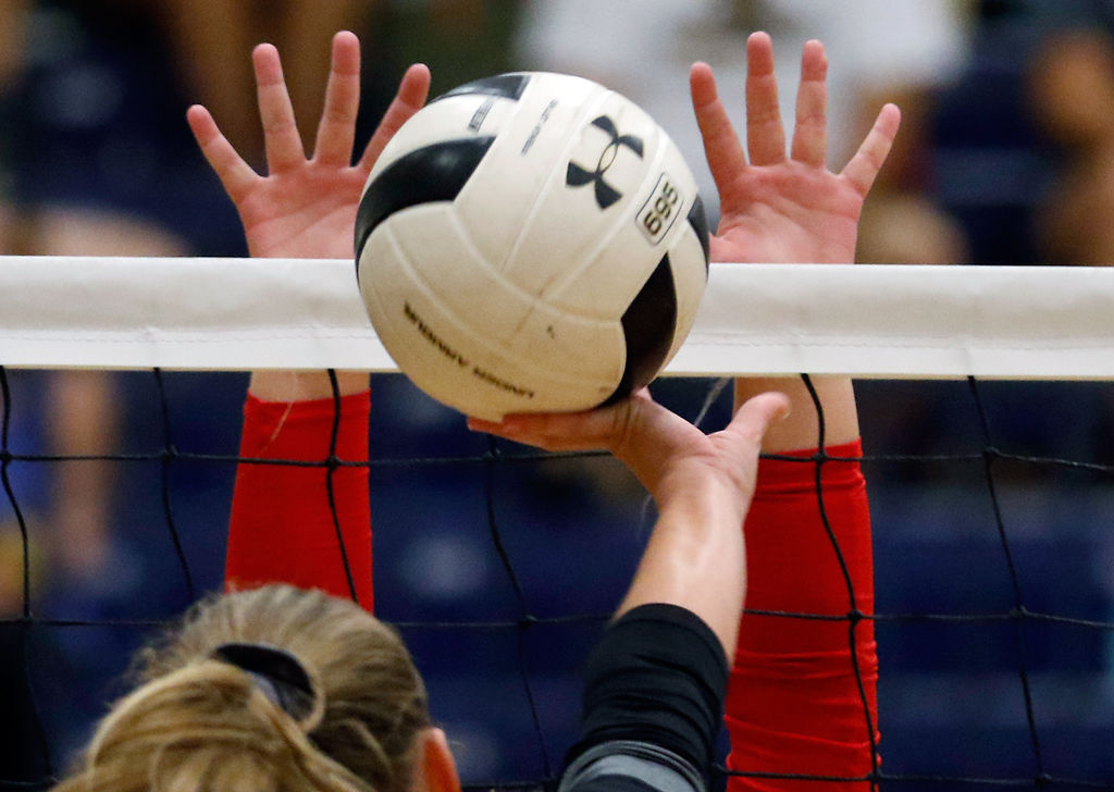 Emma Lea Benney tips the ball over the block
